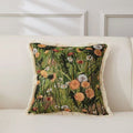 Thea Dandelion Meadow Cushion with cream fringe on a sofa