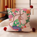 Mirabel Monkey Chinoiserie Cushion, pink cushion with a painted monkey on a peony branch and red pom-pom corners