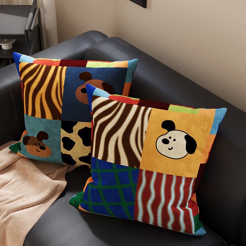 Rory Patchwork Zebra and Pups Cushion on a sofa with the matching patchwork cushion