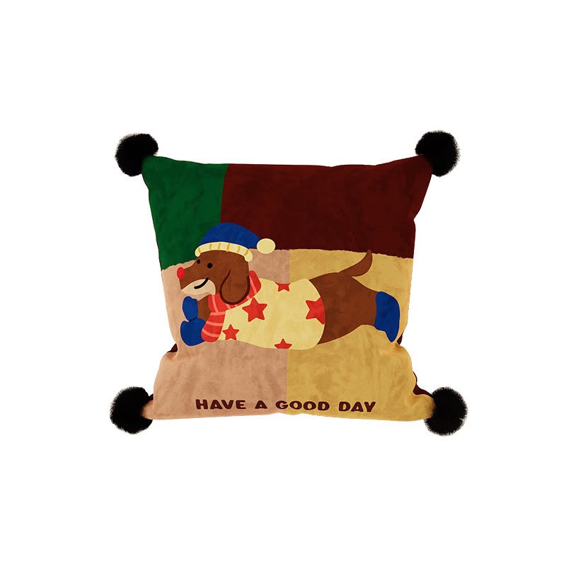 Clover Good Day Puppy Cushion, green and burgundy patchwork with a dachshund in a star jumper