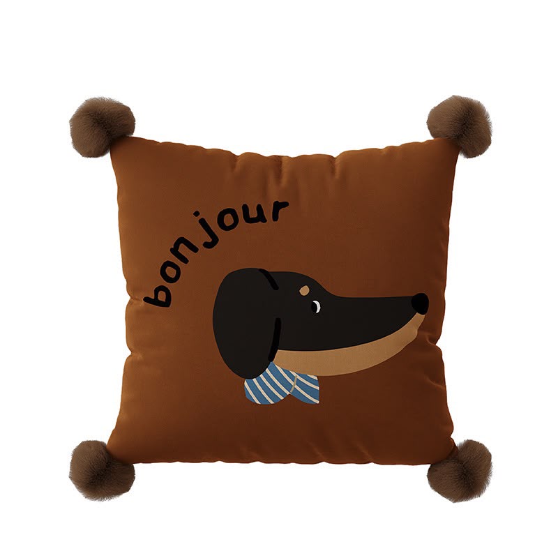 Elodie Bonjour Dachshund Cushion, brown cushion with a dachshund face and striped scarf, pom-pom corners