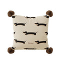 Simone Bonjour Dachshund Print Cushion, cream cushion with repeating dachshunds and pom-pom corners