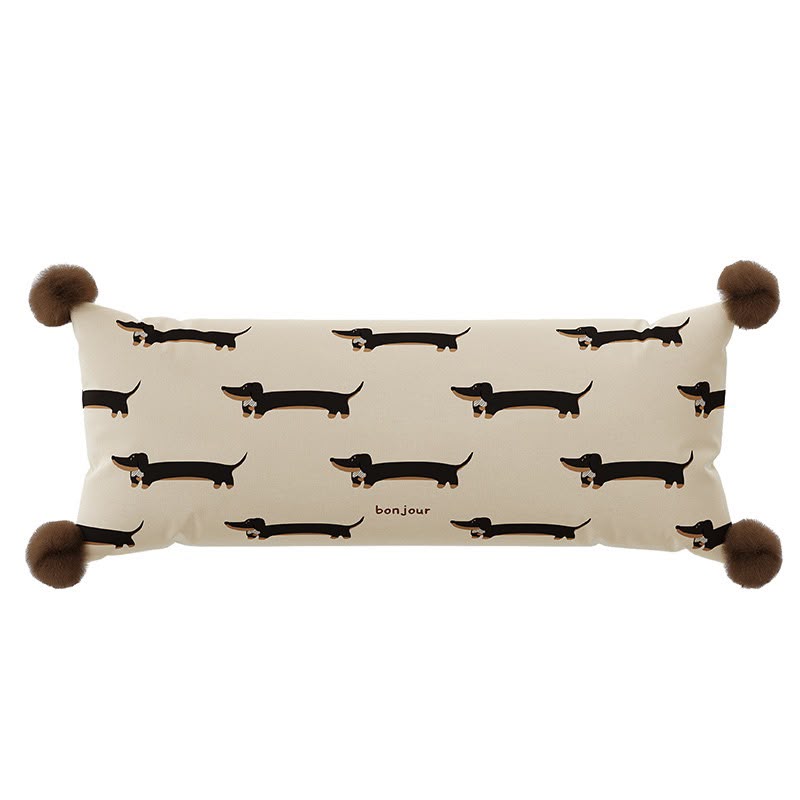 Simone Bonjour Dachshund Bolster Cushion, long cream cushion with repeating dachshunds and pom-pom corners