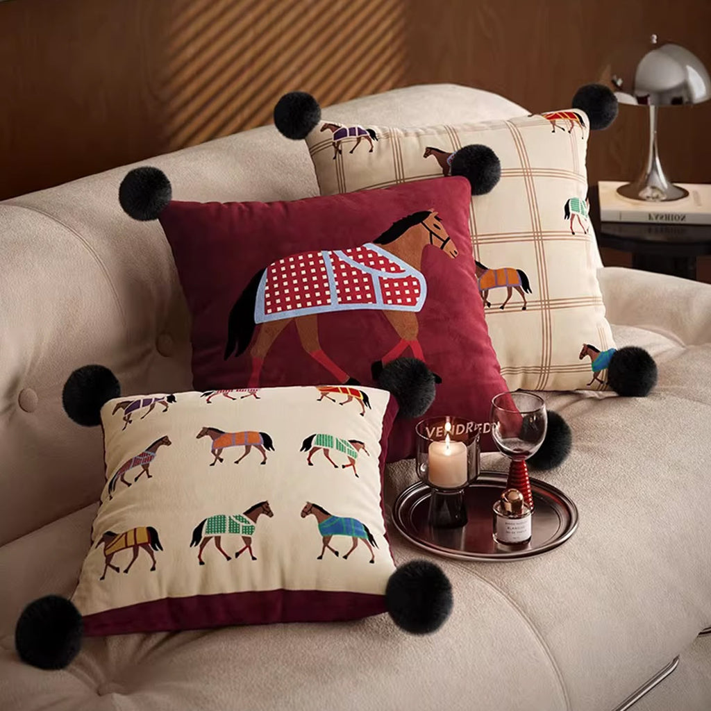 Isabelle Equestrian Horse Cushion on a sofa with the matching horse cushions