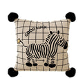 Nina Good Luck Zebra Cushion, cream grid cushion with a zebra print and black pom-pom corners