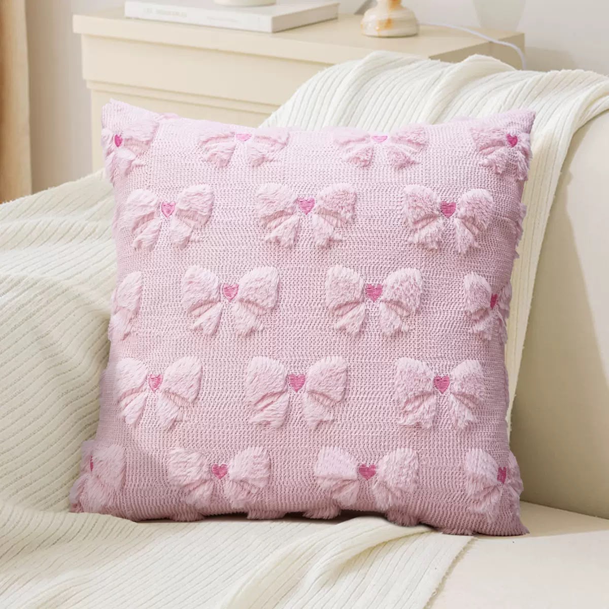 Lottie Pink Plush Bow Cushion, pink cover with tufted bows and embroidered hearts