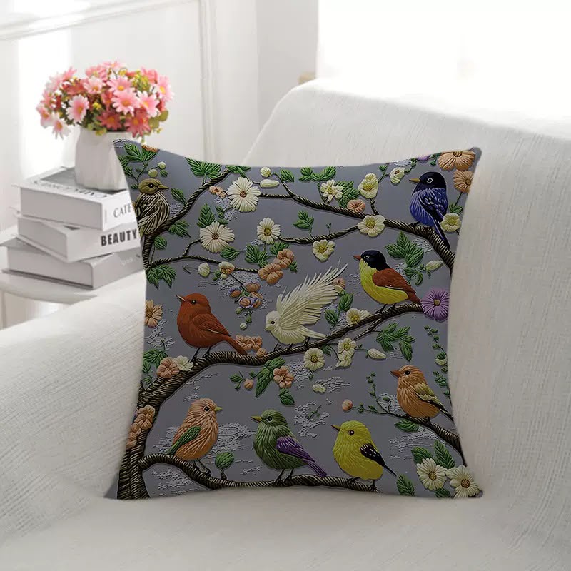 Wren Embroidered Songbird Cushion, grey cover with birds and blossom in a raised stitch design