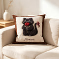 Rosabel Flower Cat Cushion, cream cushion with a tufted black cat holding a red tulip and a bow on its tail