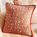 Saffron Flecked Boucle Cushion, rust boucle with pink flecks and a red velvet border