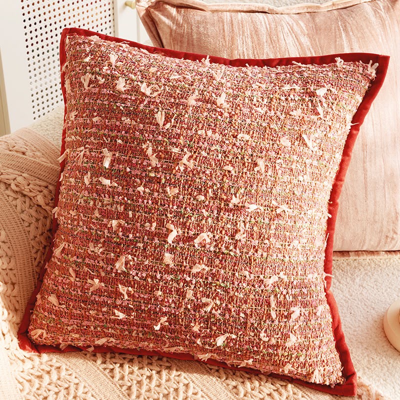 Saffron Flecked Boucle Cushion, rust boucle with pink flecks and a red velvet border