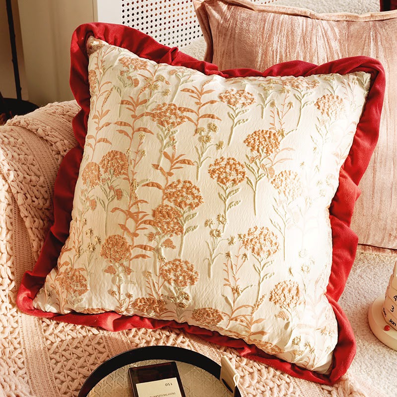 Serafina Floral Ruffle Cushion, cream embroidered blooms with a red velvet ruffle border