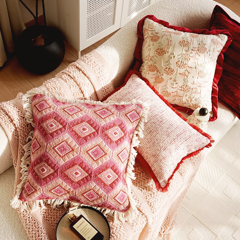 Textured cream and pink cushions styled together