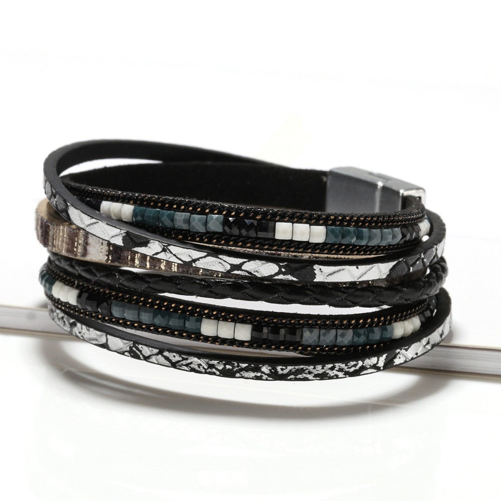 Constance black snake leather wrap bracelet — layered black and silver snake-print leather strands with beads and a magnetic clasp