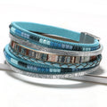 Marjorie turquoise leather wrap bracelet — layered turquoise leather, silver print, braid and blue bead strands with a magnetic clasp