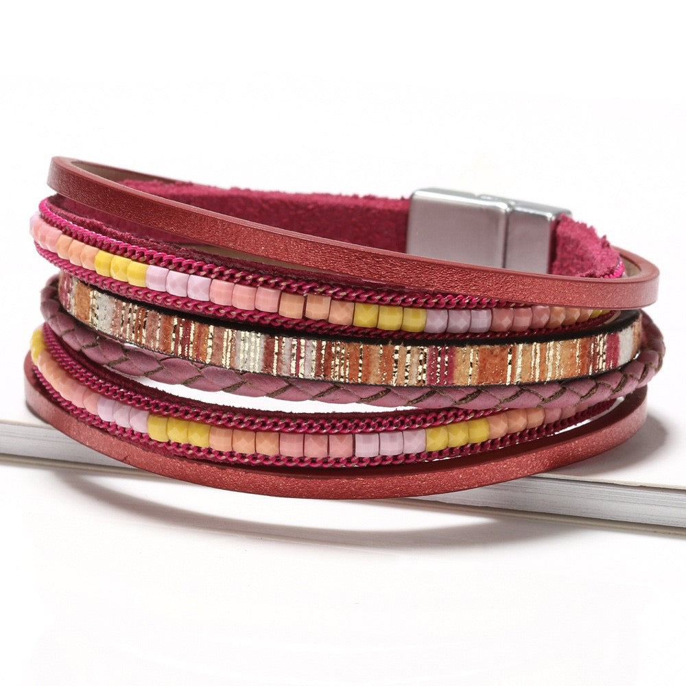 Rosalind raspberry leather wrap bracelet — layered raspberry-pink leather, braid and pink, coral and yellow bead strands with a magnetic clasp