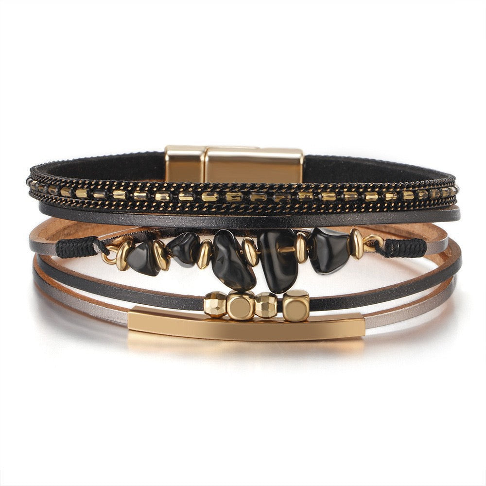 Dorothy black stone chip leather bracelet — layered black and tan leather strands with black stone chips, gold-tone bar and magnetic clasp