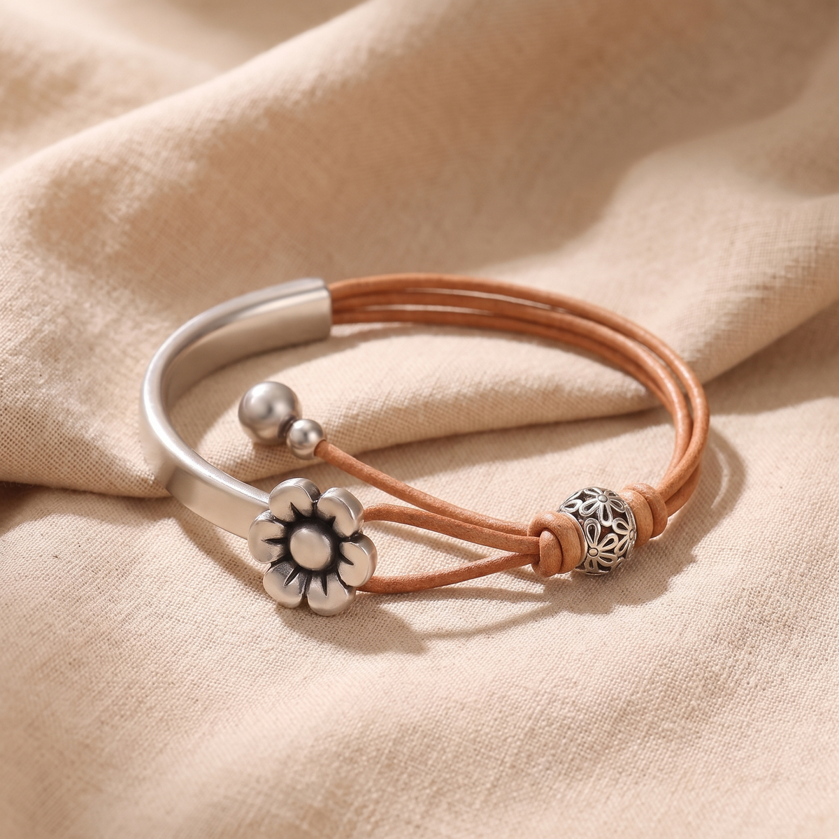 Florence Daisy Charm Leather Cuff Bracelet on linen