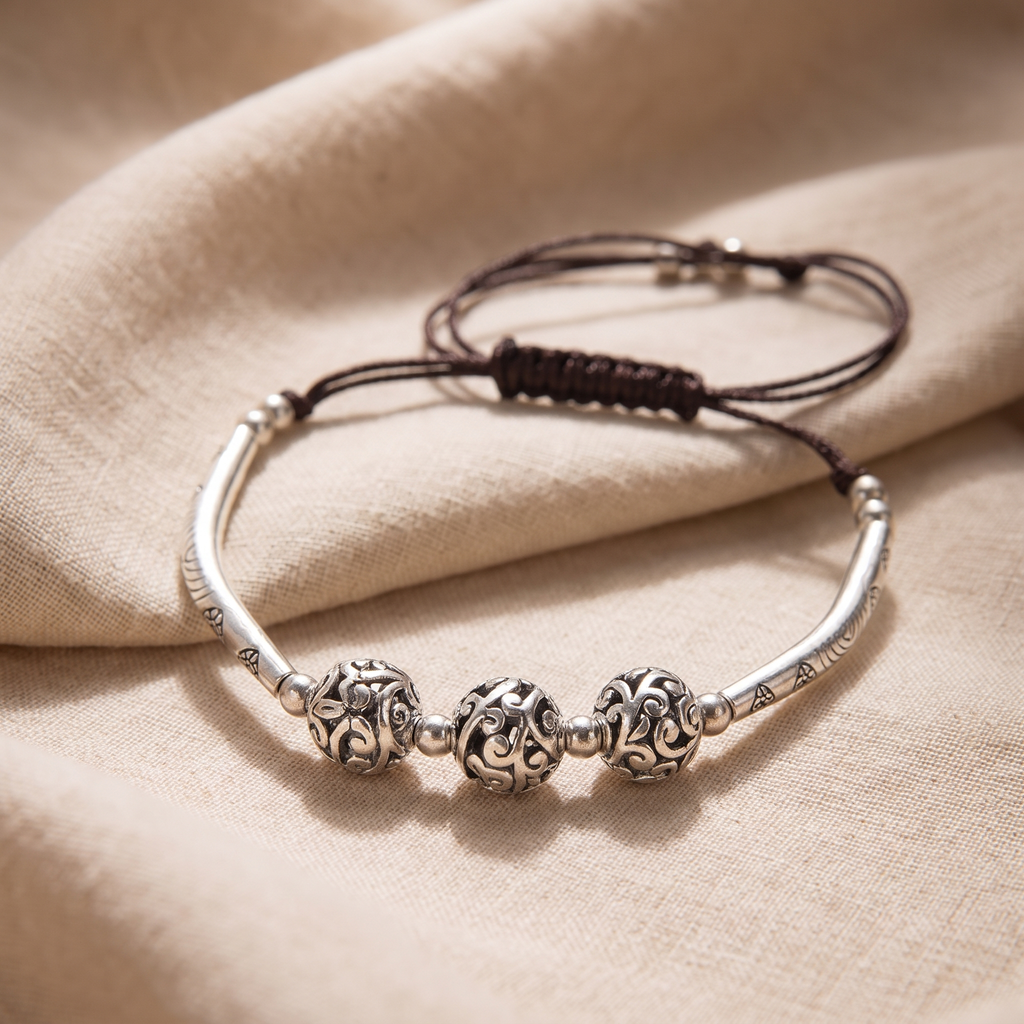 Verity Engraved Silver Bar Cord Bracelet on linen