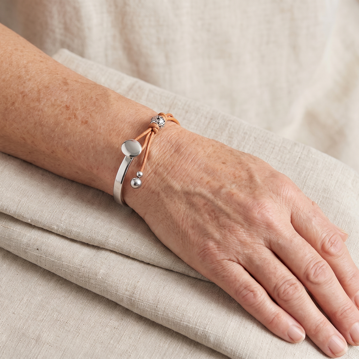 Beatrice Disc Charm Leather Cuff Bracelet worn on the wrist