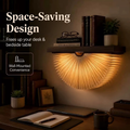 Aurora folding fan book lamp mounted under a shelf, glowing warm over a desk
